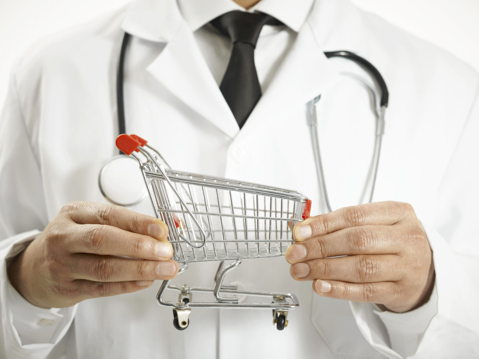 doctor holding small shopping cart